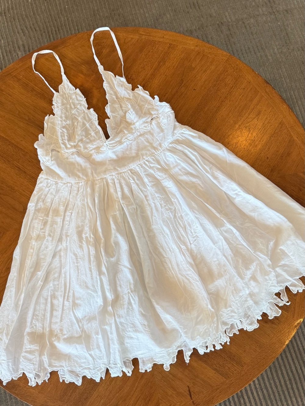 Crisp flirty, white embroidered cut lace bottom and bottom mini dress